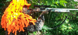 Is it possible to wear the mandatory orange vest using a ghillie suit?